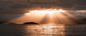 Preview wallpaper sea, sunset, clouds, sunbeams, light