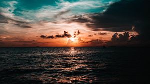 Preview wallpaper sea, sunset, clouds, dusk, waves