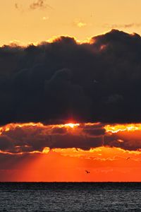 Preview wallpaper sea, sunset, clouds, sun, dusk