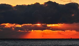 Preview wallpaper sea, sunset, clouds, sun, dusk