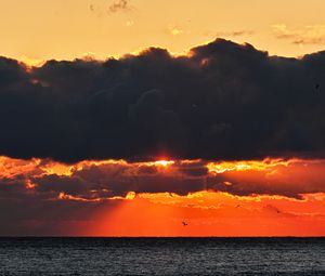 Preview wallpaper sea, sunset, clouds, sun, dusk