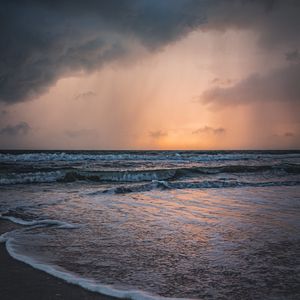 Preview wallpaper sea, sunset, clouds, waves, rain