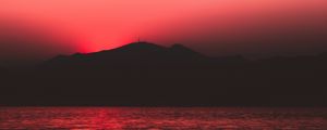 Preview wallpaper sea, sunset, dark, hill, shore