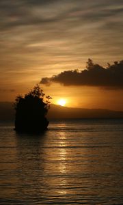 Preview wallpaper sea, sunset, dark, island, rock