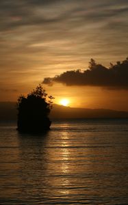 Preview wallpaper sea, sunset, dark, island, rock