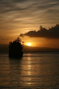 Preview wallpaper sea, sunset, dark, island, rock