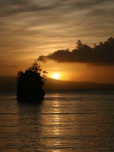 Preview wallpaper sea, sunset, dark, island, rock