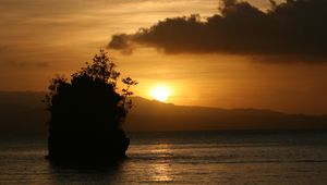 Preview wallpaper sea, sunset, dark, island, rock