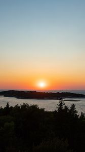 Preview wallpaper sea, sunset, horizon, island, landscape, nature