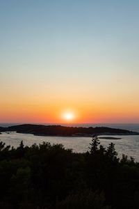 Preview wallpaper sea, sunset, horizon, island, landscape, nature