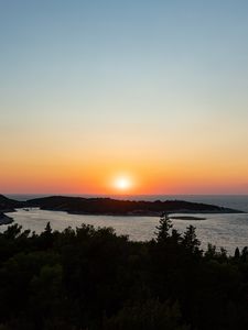 Preview wallpaper sea, sunset, horizon, island, landscape, nature