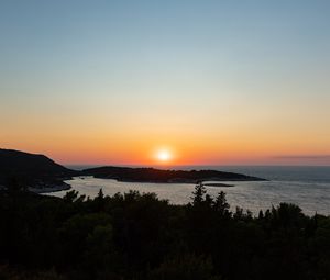 Preview wallpaper sea, sunset, horizon, island, landscape, nature