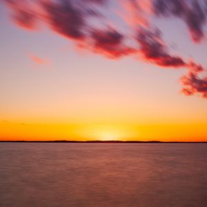 Preview wallpaper sea, sunset, horizon, blur, long exposure, dusk