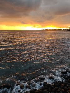 Preview wallpaper sea, sunset, horizon, pebbles