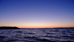 Preview wallpaper sea, sunset, loneliness, alone, silhouette, rocks