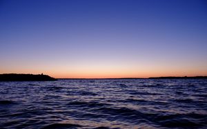 Preview wallpaper sea, sunset, loneliness, alone, silhouette, rocks