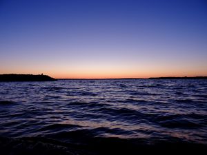 Preview wallpaper sea, sunset, loneliness, alone, silhouette, rocks