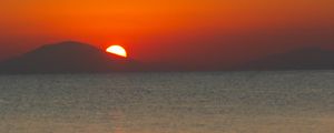 Preview wallpaper sea, sunset, mountains, sky, nature, dark