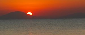 Preview wallpaper sea, sunset, mountains, sky, nature, dark