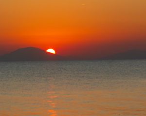 Preview wallpaper sea, sunset, mountains, sky, nature, dark