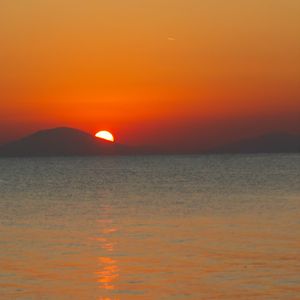 Preview wallpaper sea, sunset, mountains, sky, nature, dark