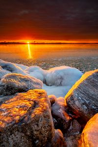 Preview wallpaper sea, sunset, shore, stones, ice