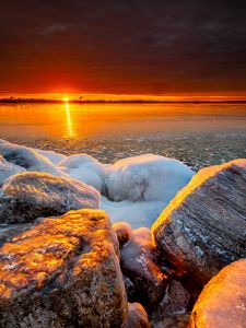 Preview wallpaper sea, sunset, shore, stones, ice