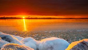 Preview wallpaper sea, sunset, shore, stones, ice