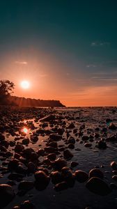 Preview wallpaper sea, sunset, stones, shore, light