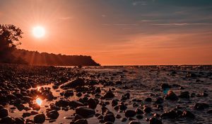 Preview wallpaper sea, sunset, stones, shore, light
