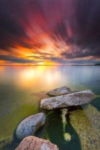 Preview wallpaper sea, sunset, stones, water, shore