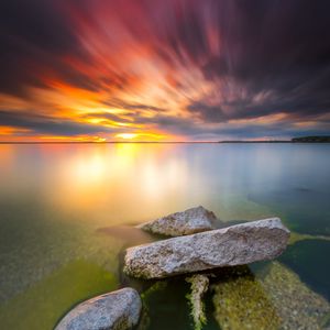 Preview wallpaper sea, sunset, stones, water, shore