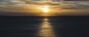 Preview wallpaper sea, sunset, sun, horizon, ripples, waves