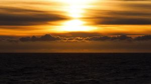 Preview wallpaper sea, sunset, sun, waves, clouds, dusk