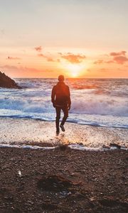 Preview wallpaper sea, surf, alone, sunset, man, solitude, wales, united kingdom