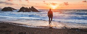 Preview wallpaper sea, surf, alone, sunset, man, solitude, wales, united kingdom