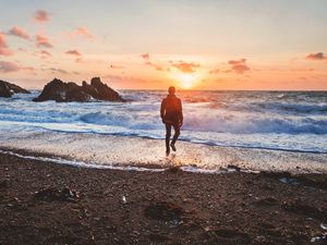 Preview wallpaper sea, surf, alone, sunset, man, solitude, wales, united kingdom