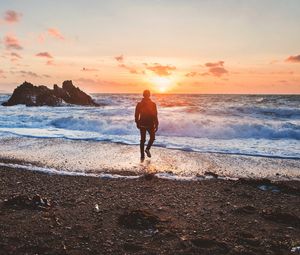 Preview wallpaper sea, surf, alone, sunset, man, solitude, wales, united kingdom