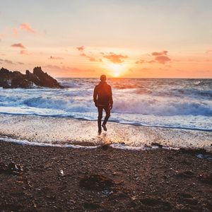 Preview wallpaper sea, surf, alone, sunset, man, solitude, wales, united kingdom