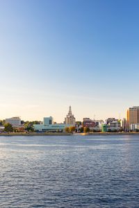 Preview wallpaper sea, tower, embankment, buildings, city