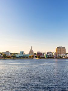 Preview wallpaper sea, tower, embankment, buildings, city