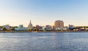 Preview wallpaper sea, tower, embankment, buildings, city