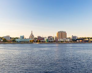 Preview wallpaper sea, tower, embankment, buildings, city