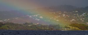 Preview wallpaper sea, trees, rainbow, houses