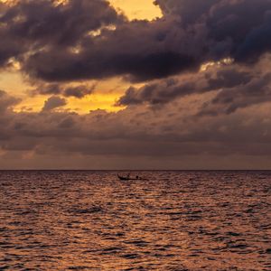 Preview wallpaper sea, water, boat, clouds, sky, twilight