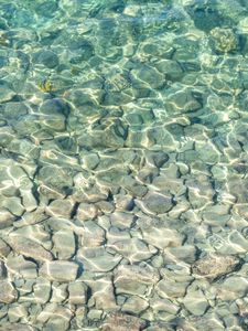 Preview wallpaper sea, water, bottom, stones, pebbles, glare