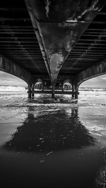 360x640 Wallpaper sea, water, bridge, bw