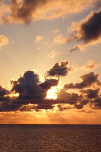 Preview wallpaper sea, water, clouds, sun, sunset, nature