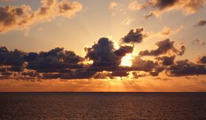 Preview wallpaper sea, water, clouds, sun, sunset, nature