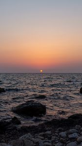 Preview wallpaper sea, water, stones, sun, sunset